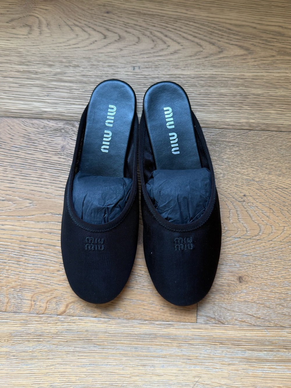 Miu Miu Black Mesh Slip-On Mules with Embroidered Logo